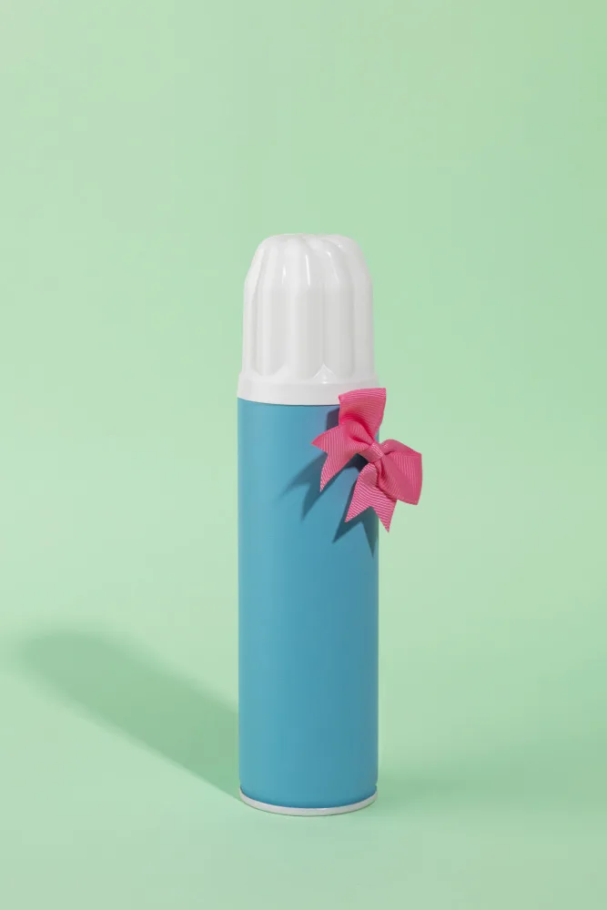 Ramiro, Julia: Blue Spray Bottle Adorned with Pink Bow