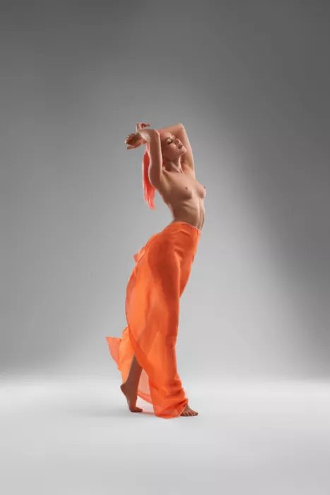 Guryanov, Andrey: Naked slim female model with dyed hair dancing on her tiptoes
