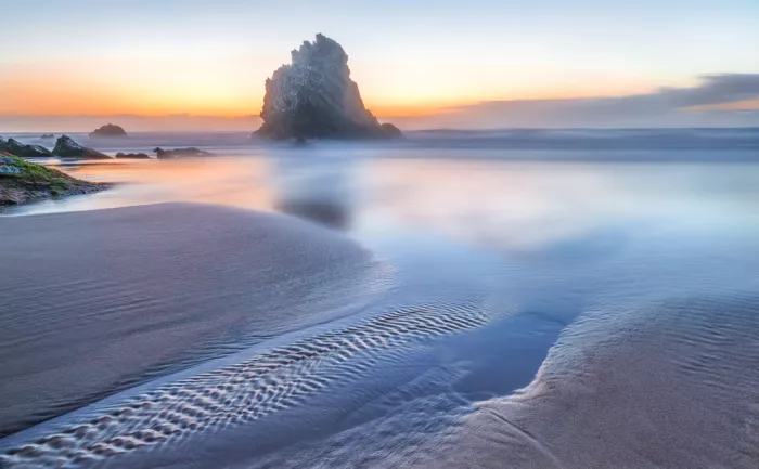Niu, Nancy: Sunset on the beach in Adraga Portugal.