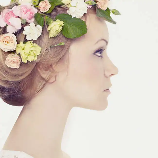 Unknown: Young woman with delicate flowers in her hair