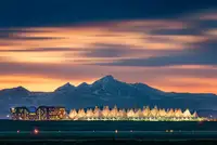 Xu, Mei: Denver International Airport in dusk with Longs Peak as background