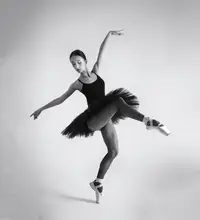 Alexandr: Black Swan. a ballerina in a black tutu shows elements of ballet