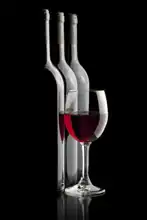 Unknown: Still life with wine on a black background