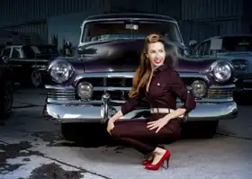 Unknown: Pin up girl in front of car