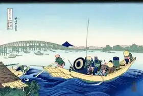 Hokusai, Katsushika: Sunset across the Ryogoku bridge from the bank of the Sumida river at Onmagayashi in Edo
